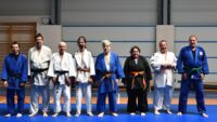 Ralf, Jörg und Laura mit ihrer Judogruppe